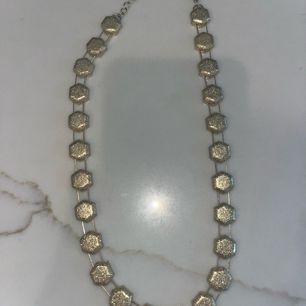 Stylish gold-toned necklace hexagonal-shaped links connected by delicate links